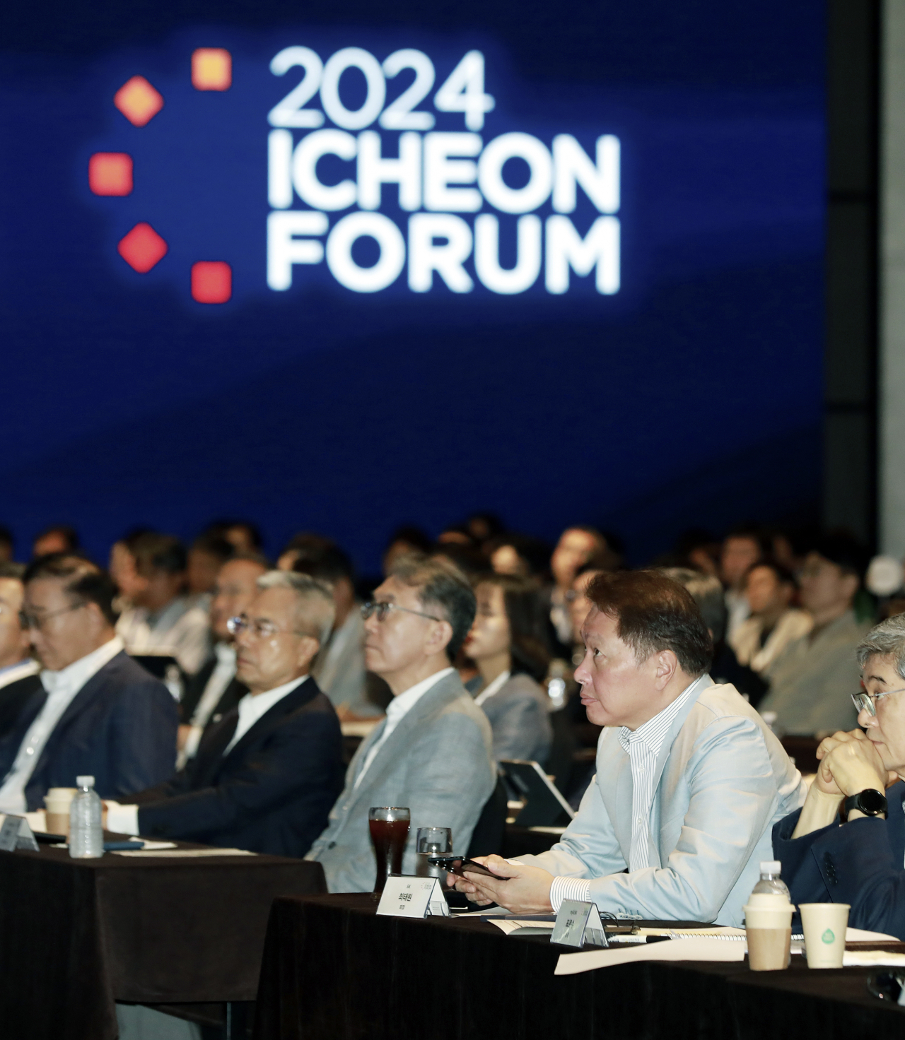 SK Group Chairman Chey Tae-won (second from right) attends the group's annual Icheon forum that kicked off at a Seoul hotel on Monday. (SK Group)