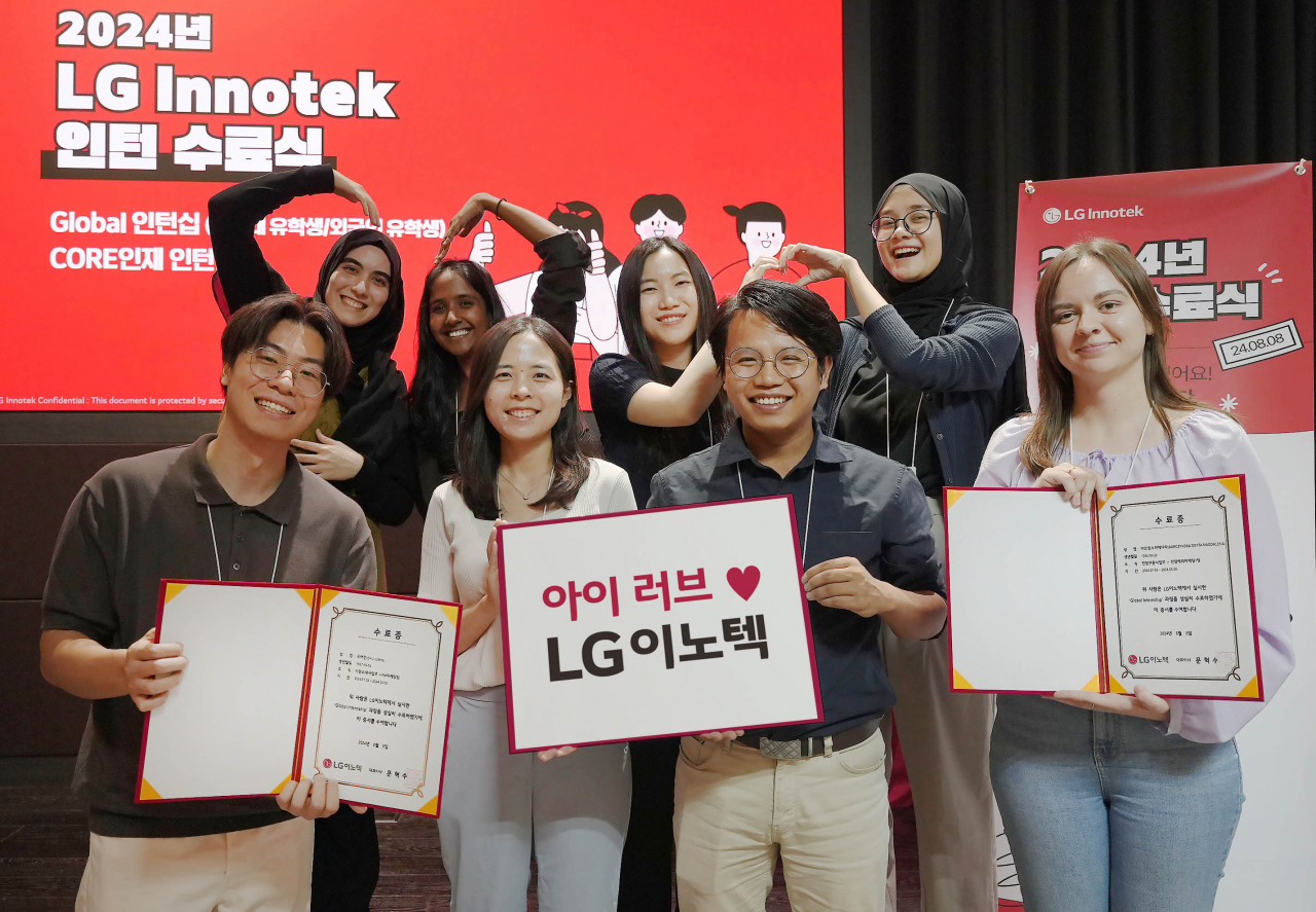 This year's participants in LG Innotek's global internship program pose for a photo during the completion ceremony held on Aug. 8 at the company headquarters in Magok, western Seoul. (LG Innotek)