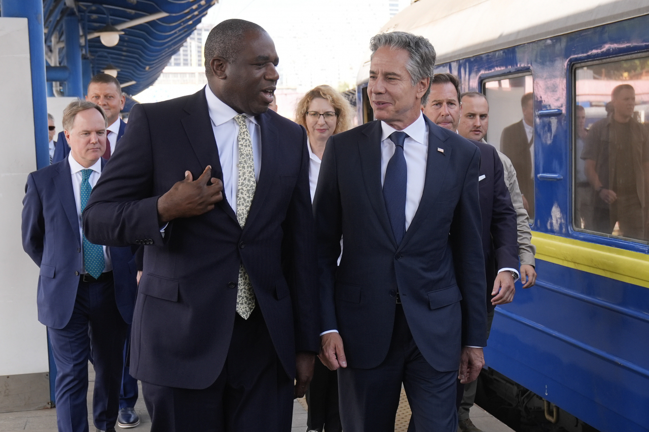 US Secretary of State Antony Blinken (right) and British Foreign Secretary David Lammy arrive at the train station in Kyiv, Ukraine, on Wednesday. (Pool Photo via AP)