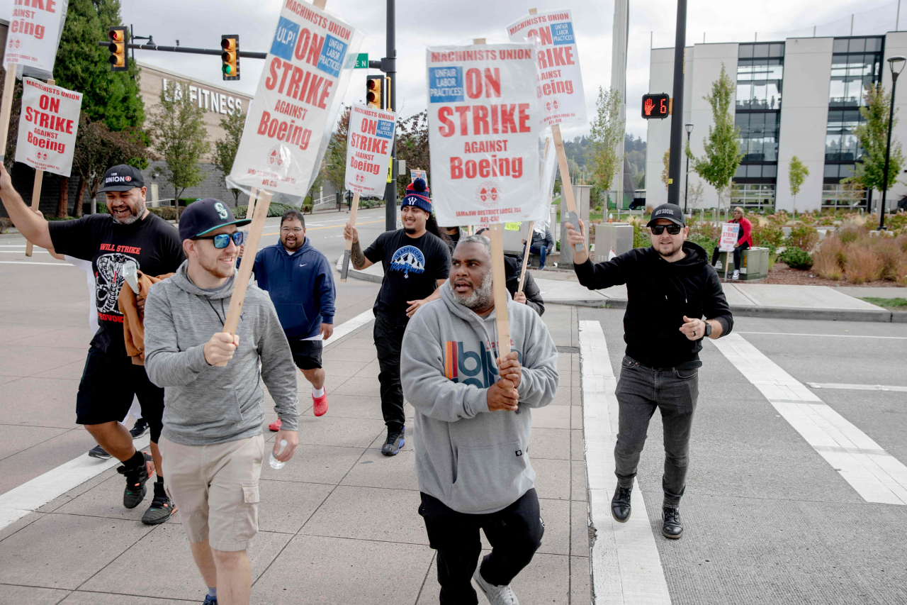 Striking Boeing workers and their supporters picket outside the Boeing Co. manufacturing facility in Renton, Washington on September 16, 2024. In the first strike in 16 years, thousands of Boeing factory workers walked off the job in a dispute of pay that is likely to effect the manufacture of Boeing commercial planes. (AFP/ Yehyun Kim)