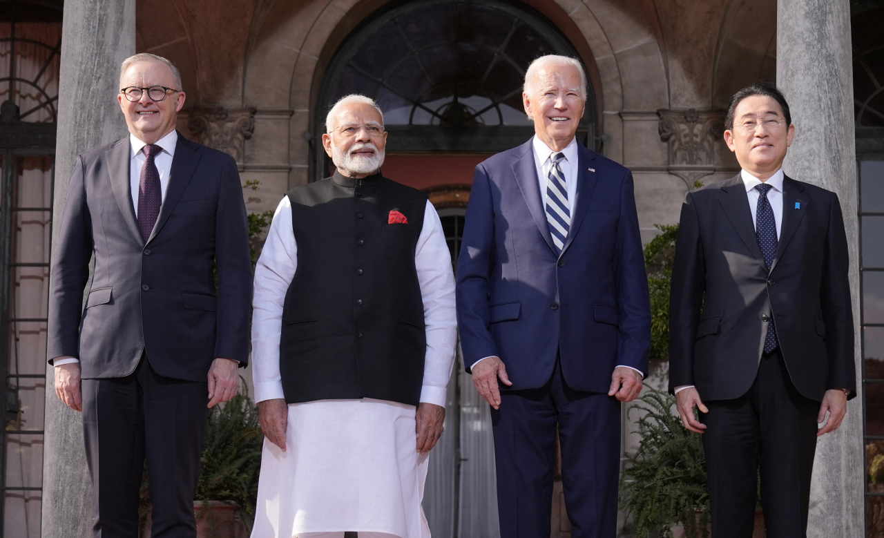 US President Joe Biden (2nd from right), Australian Prime Minister Anthony Albanese (left), Indian Prime Minister Narendra Modi (2nd from left), and Japanese Prime Minister Fumio Kishida pose for a photo at the Archmere Academy in Wilmington, Delaware, on Saturday as they gather for a Quad summit. (AFP)