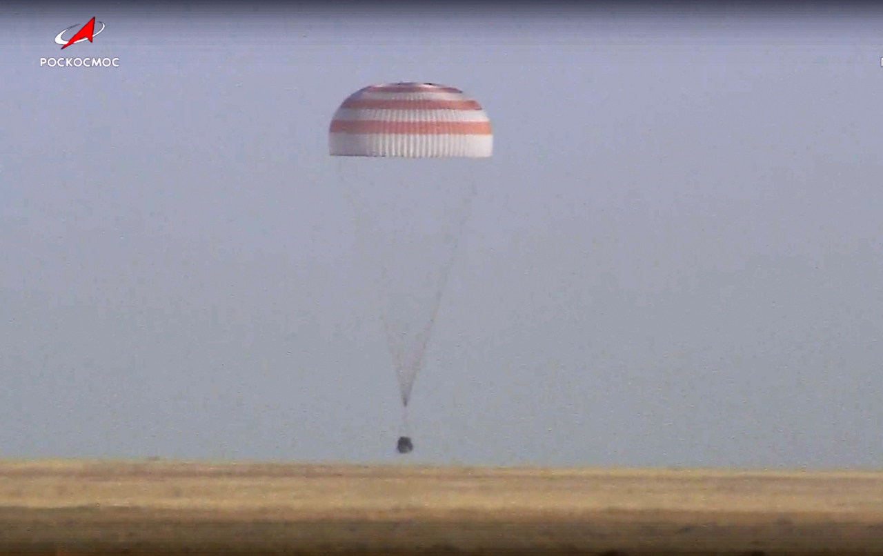 In this photo taken from video released by Roscosmos space corporation, Russian Soyuz MS-25 space capsule carrying the NASA astronaut Tracy Dyson and the Roscosmos cosmonauts Oleg Kononenko and Nikolai Chub lands south-east of the Kazakh town of Zhezkazgan, Kazakhstan, Monday. (Roscosmos space corporation via AP)