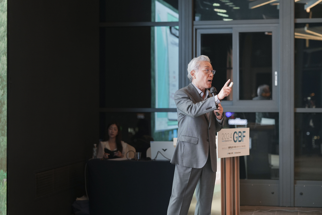 Professor Emeritus Kim Tae-yoo of Seoul National University gives a lecture on South Korea's rapidly declining birthrate at The Korea Herald's Global Business Forum, held Wednesday at The Ambassador Seoul hotel. (The Korea Herald)