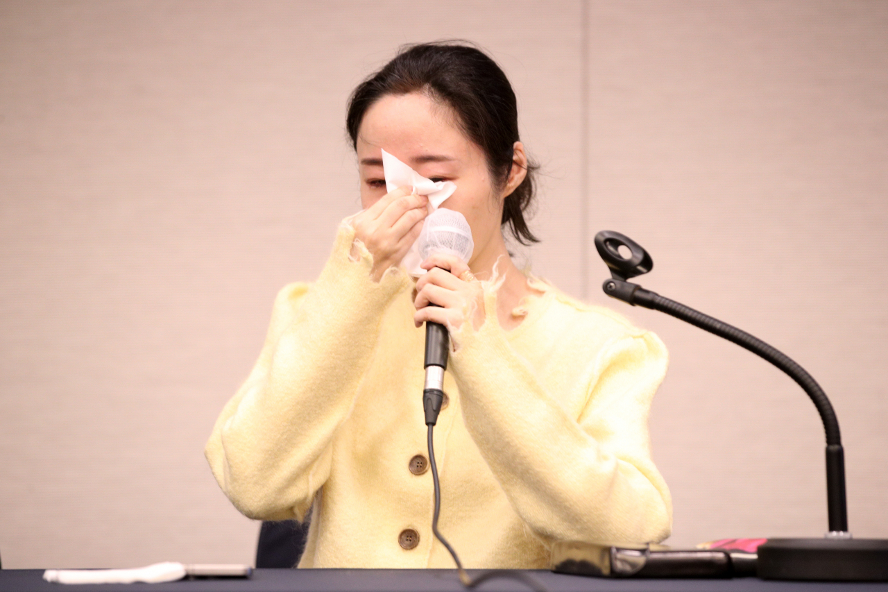 Min Hee-jin, former CEO of Ador, sheds tears during a press conference held at the Press Center in Jung-gu, Seoul, on May 31. (Im Se-jun/The Korea Herald)