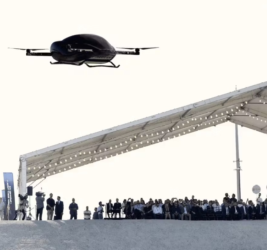 Participants at Airtaxi World Congress observe the demonstration of an electric vertical take-off and landing aircraft, or eVTOL. (AirTaxi World Congress)