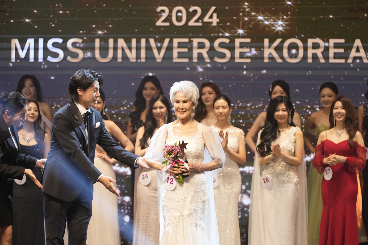 Choi Soon-hwa (center) poses after winning the best dressed award in the 2024 Miss Universe Korea contest in Gangnam, Seoul, Monday. (AP-Yonhap)