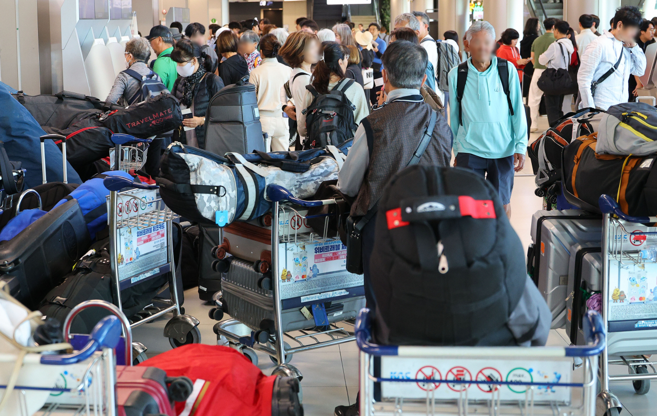 The packed terminal of Gimpo International Airport in Seoul is seen in this photo taken Sunday. (Yonhap)