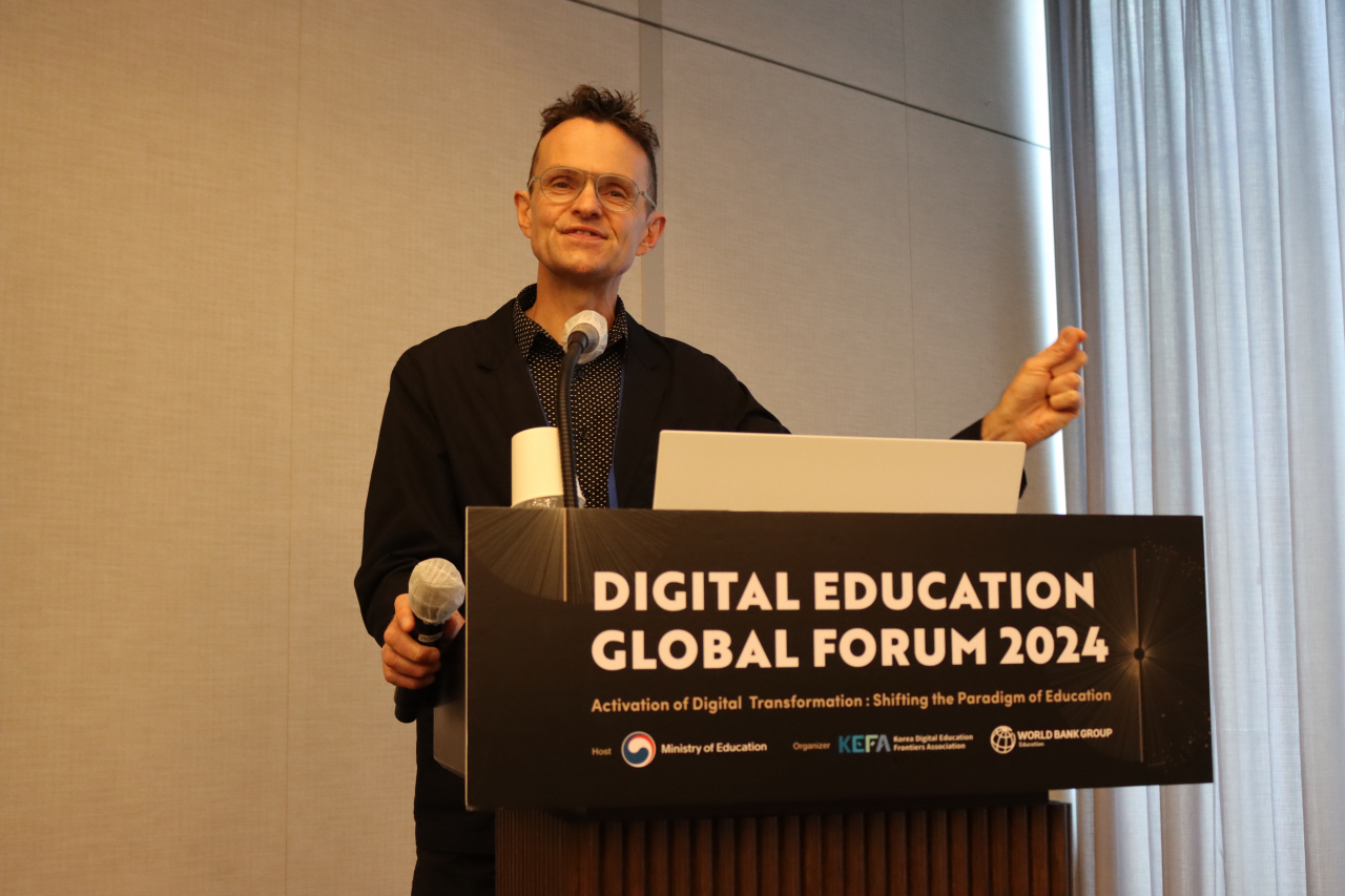 Neil Selwyn, education and technology professor at Monash University, speaks at the Digital Education Global Forum held at Coex in Gangnam, southern Seoul on Sept. 24, where educational officials from 17 countries gathered to discuss challenges and strategies in digital transformation. (Korea Digital Education Frontiers Association)