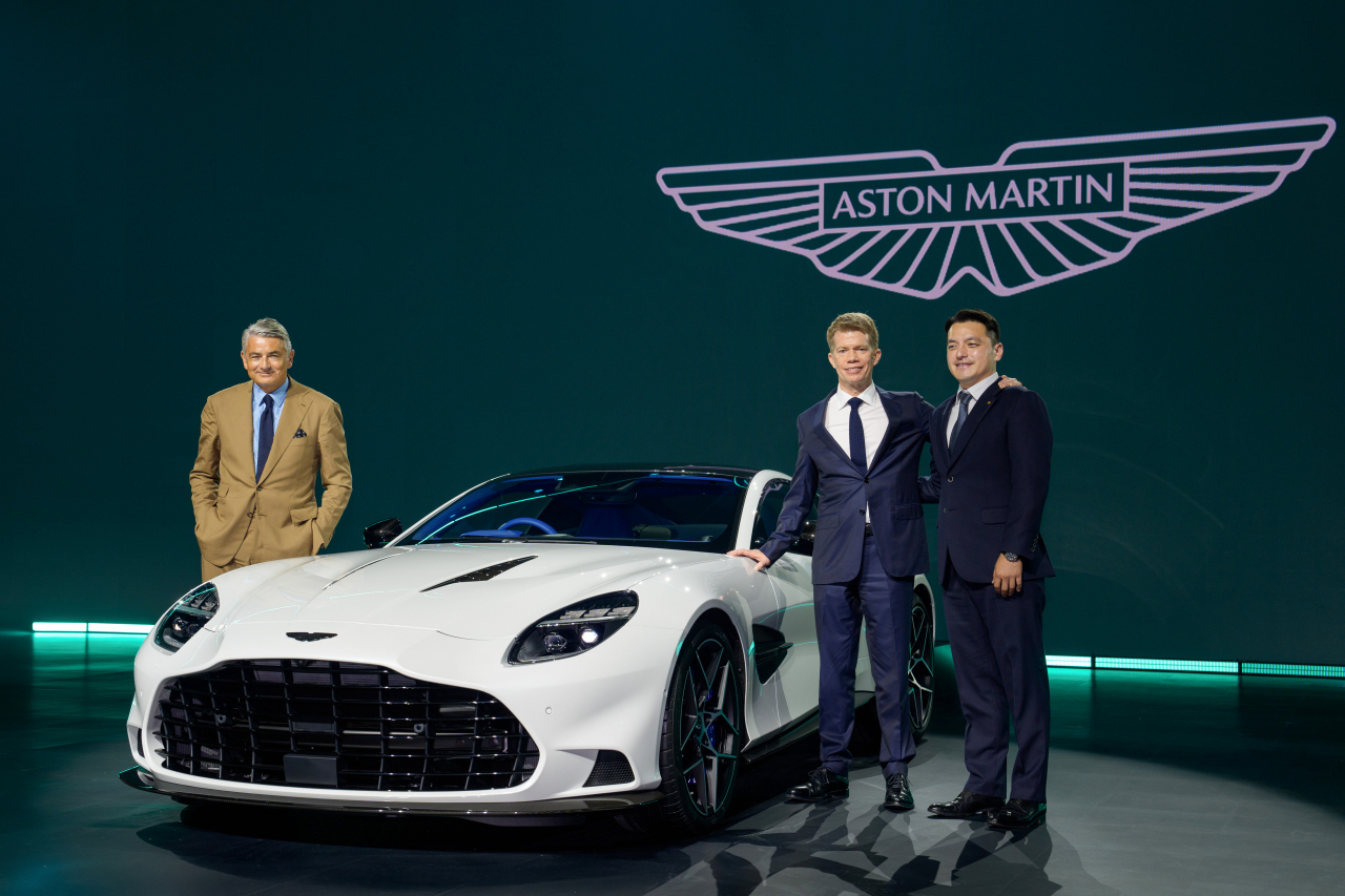 (from left) Marco Mattiacci, chief brand officer and commercial officer at Aston Martin; Greg Adams, regional president of Aston Martin Asia; and Gwon Hyuk-min, CEO and president of Britannia Auto, pose for a photo after a press conference held at a hotel in Incheon on Friday. (Aston Martin)