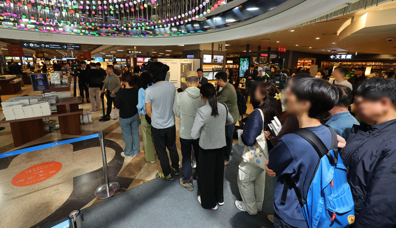 Visitors line up to purchase Han Kang's works at Kyobo Book Center's Gwanghwamun store in central Seoul on Friday. (Yonhap)