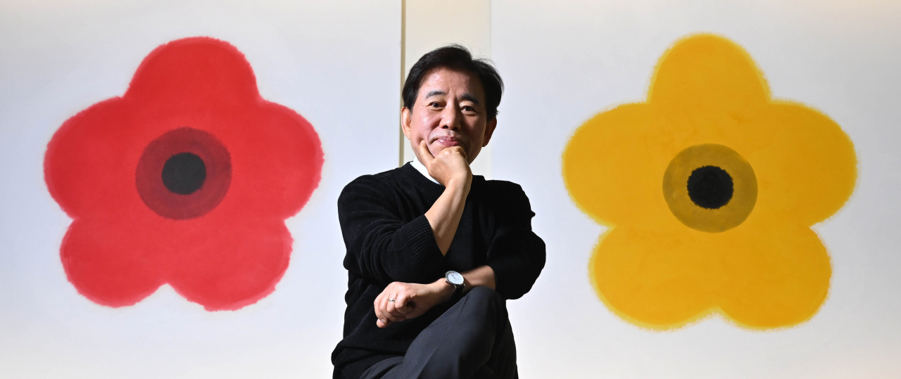 Kim Byung-jong poses for a photo at the exhibition “The Rhapsody of Life: A Half-Century Art Archive of Kim Byung-jong” on Friday at Culture Station Seoul 284 in Seoul. (Im Se-jun/The Korea Herald)