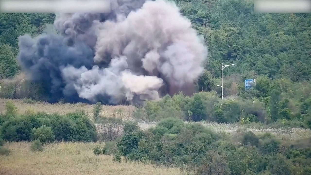 Smoke rises after North Korea blows up sections of inter-Korean roads on its side of the border between the two Koreas, according to South Korea's military, as seen from the South Korean side, Tuesday, in this screen grab from a handout video. (South Korean Defence Ministry)