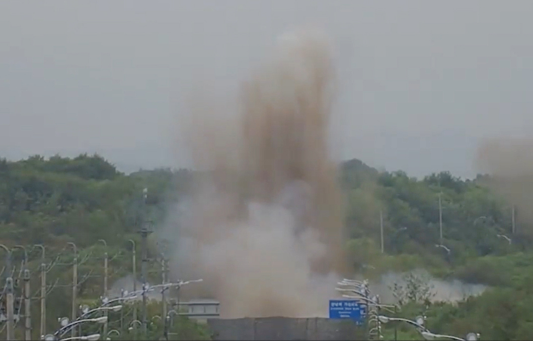 This image, captured from footage provided by South Korea's Joint Chiefs of Staff on Tuesday, shows North Korea blowing up parts of the Gyeongui roads connected to South Korea earlier in the day. (Yonhap)