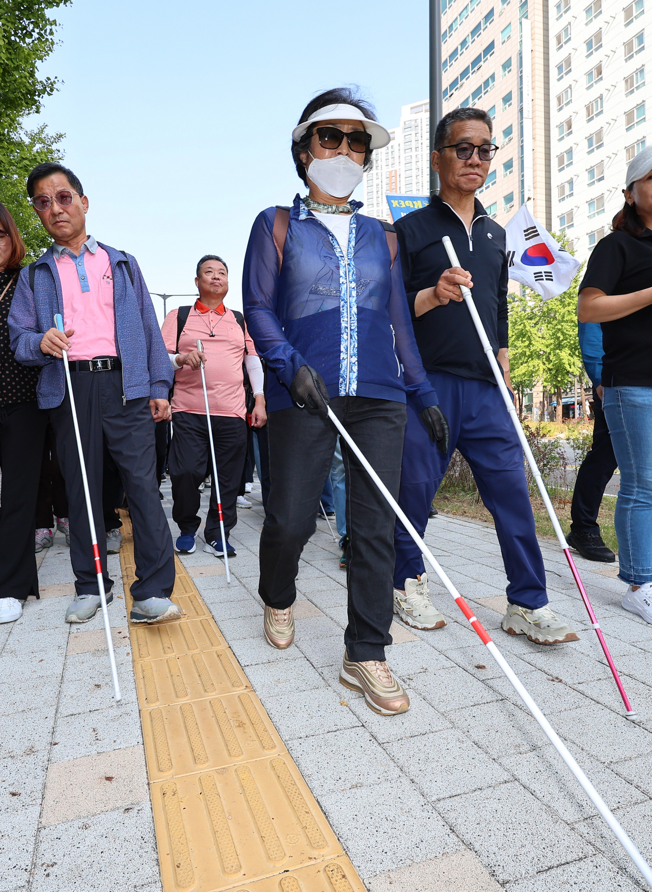 A group of visually impaired people in Incheon participate in a demonstration advocating for the rights of the disabled near Incheon City Hall on Oct. 11. (Yonhap)