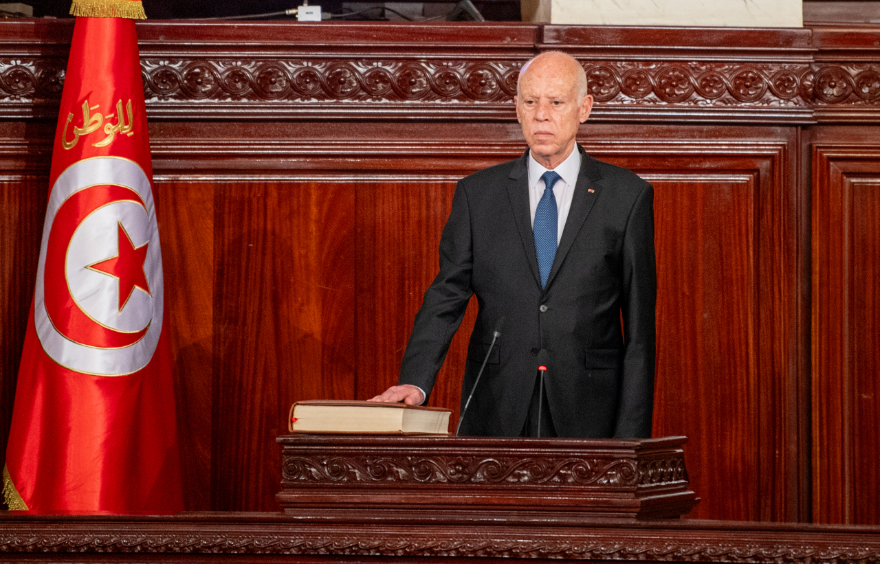 A handout photo made available by the Tunisian Presidency Press Service shows Tunisian President Kais Saied taking the oath of office during his swearing-in ceremony for a second term as Tunisia's president at the Parliament in Tunis, Tunisia, on Monday. (Xinhua-Yonhap)