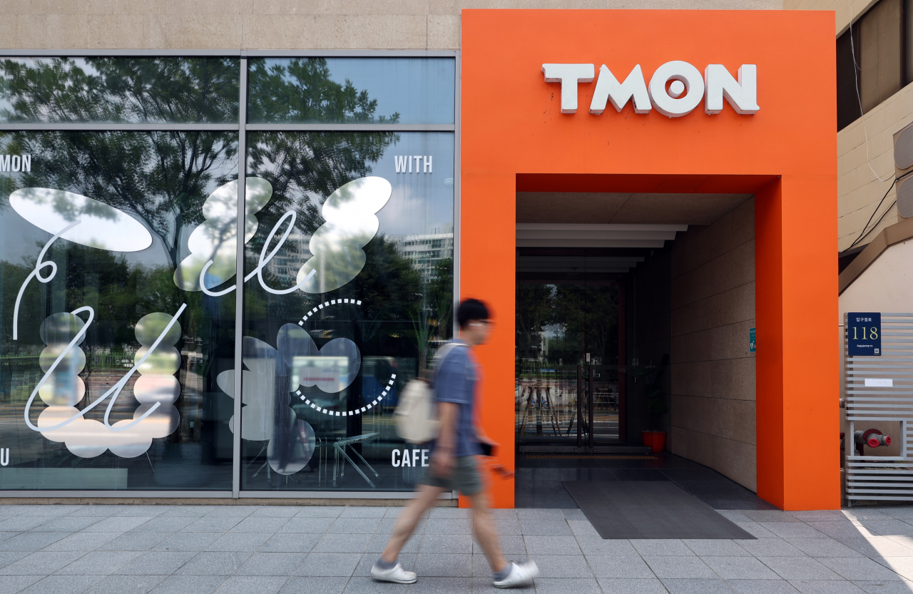 A person walks by Tmon headquarters in southern Seoul on Aug. 12. (Newsis)