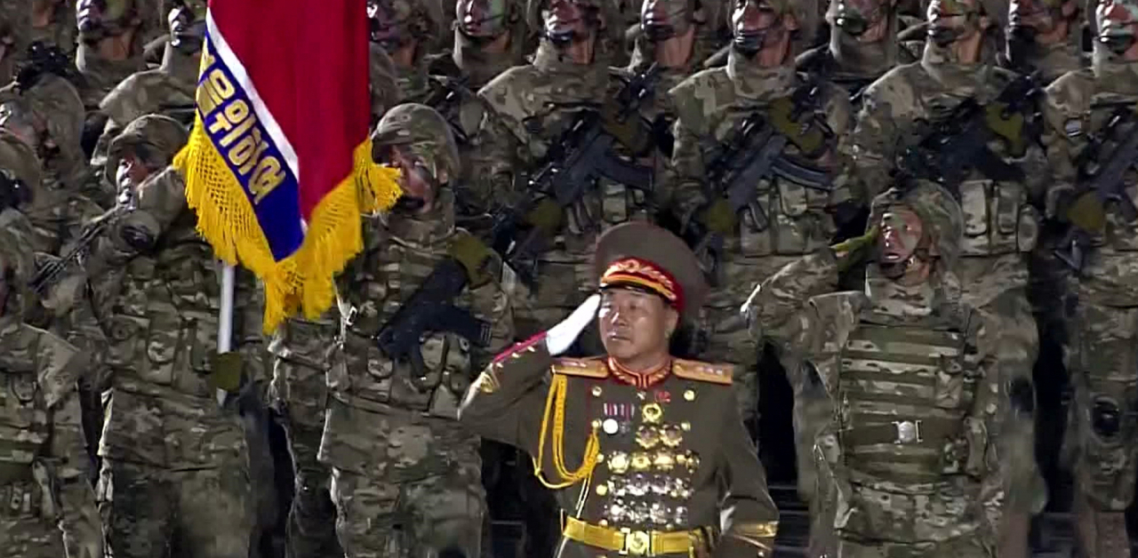 This file image, captured from video footage aired by North Korea's official Korean Central TV on Oct. 10, 2020, shows Kim Yong-bok (center), suspected of leading North Korean troops deployed to Russia, taking part in a military parade in Pyongyang. (KCNA)