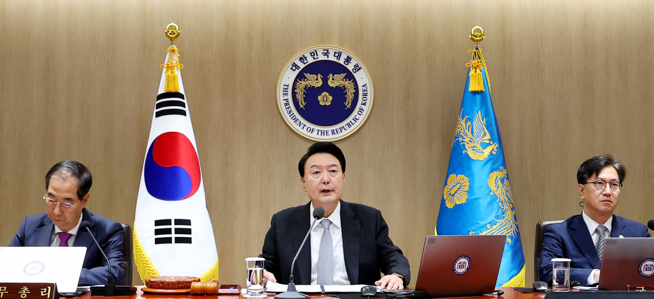 President Yoon Suk Yeol (center) speaks during the Cabinet meeting at the presidential office in Seoul on Tuesday. (Pool photo via Yonhap)