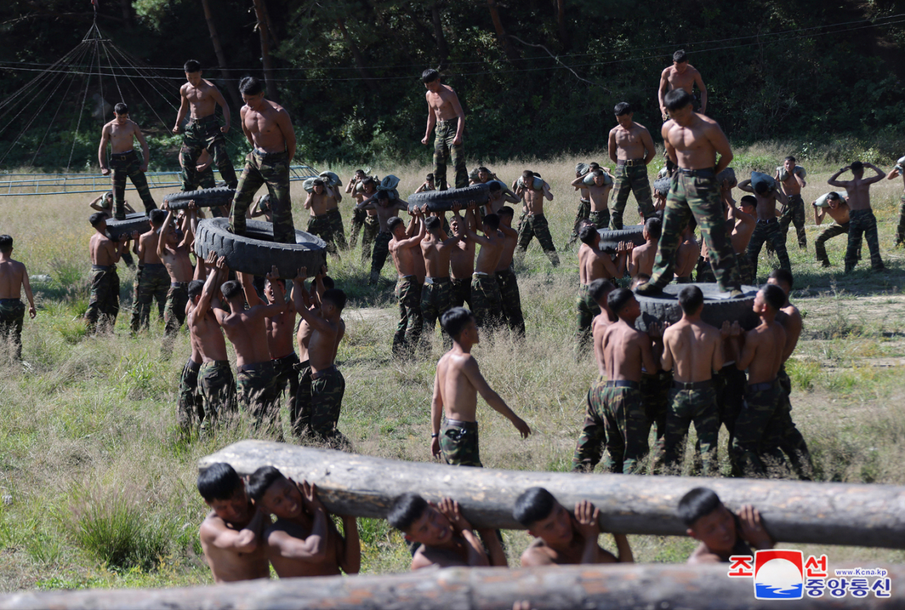 North Korean special operations troops conduct a drill during North Korean leader Kim Jong-un's visit to their training base in western Pyongyang on Oct. 2, 2024, a day after South Korea's Armed Forces Day, in this photo provided by the North's official Korean Central News Agency. (Yonhap)