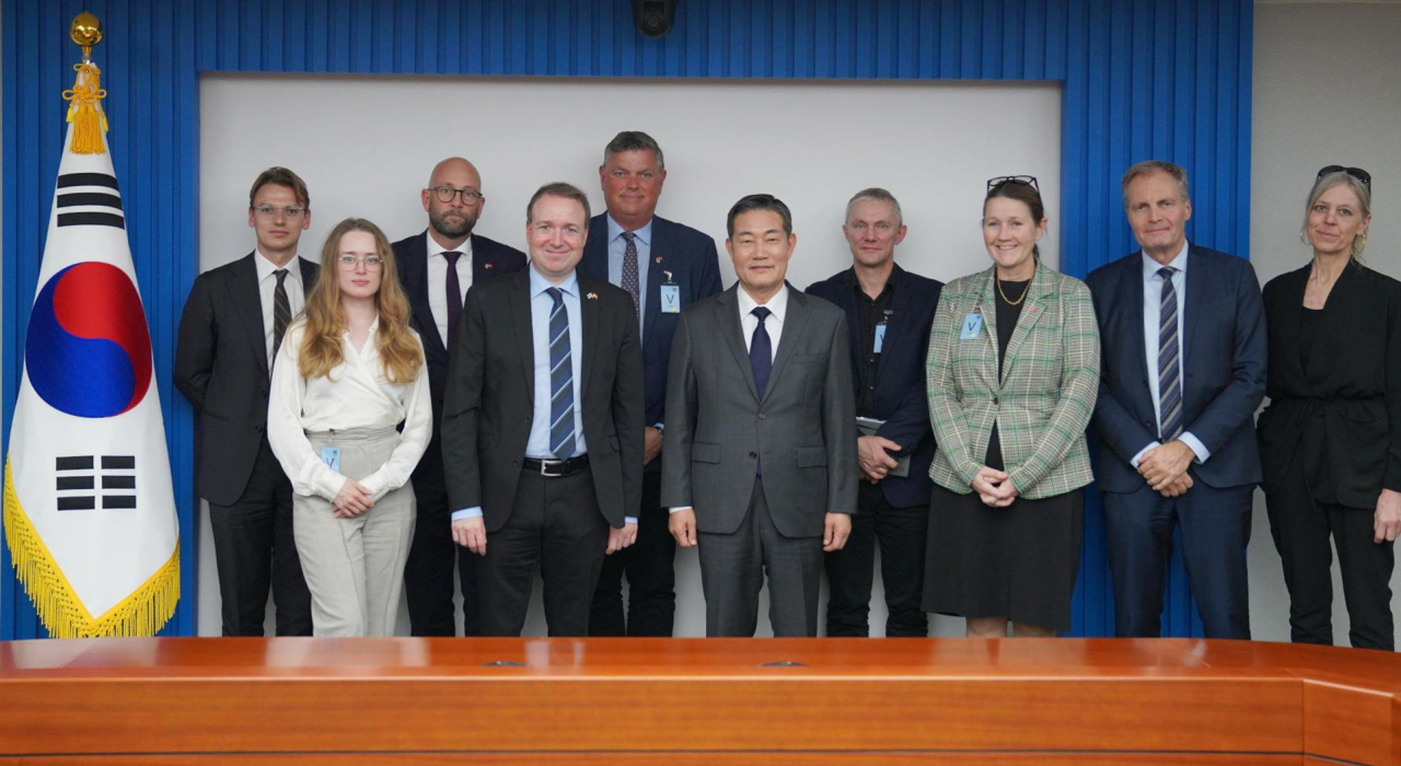 National Security Adviser Shin Won-sik (front row, 3rd from left) poses with a Danish parliament delegation at the presidential office in Seoul on Tuesday, in this photo provided by his office.