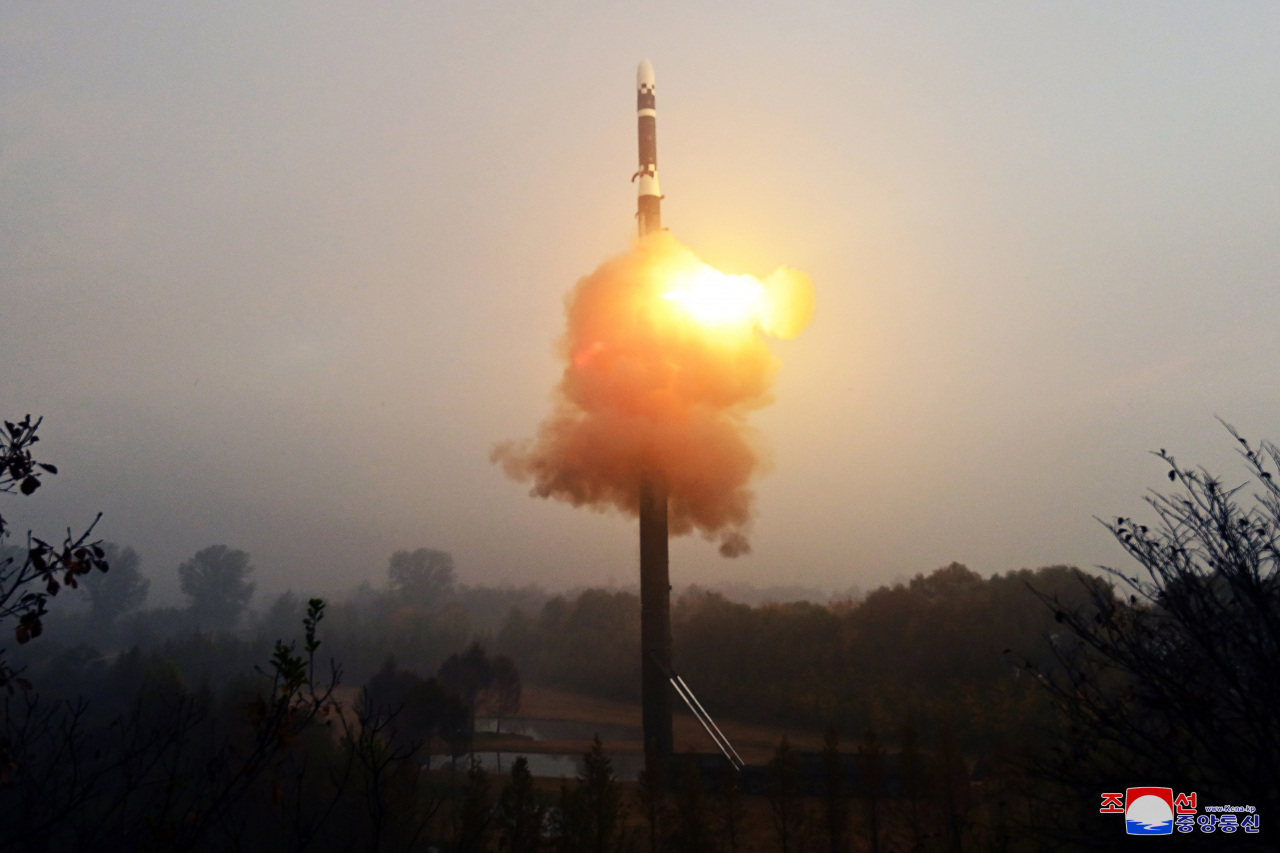 This photo, carried by North Korea's official Korean Central News Agency on Friday, shows the North firing the new Hwasong-19 intercontinental ballistic missile the previous day, guided by its leader Kim Jong-un. (KCNA)