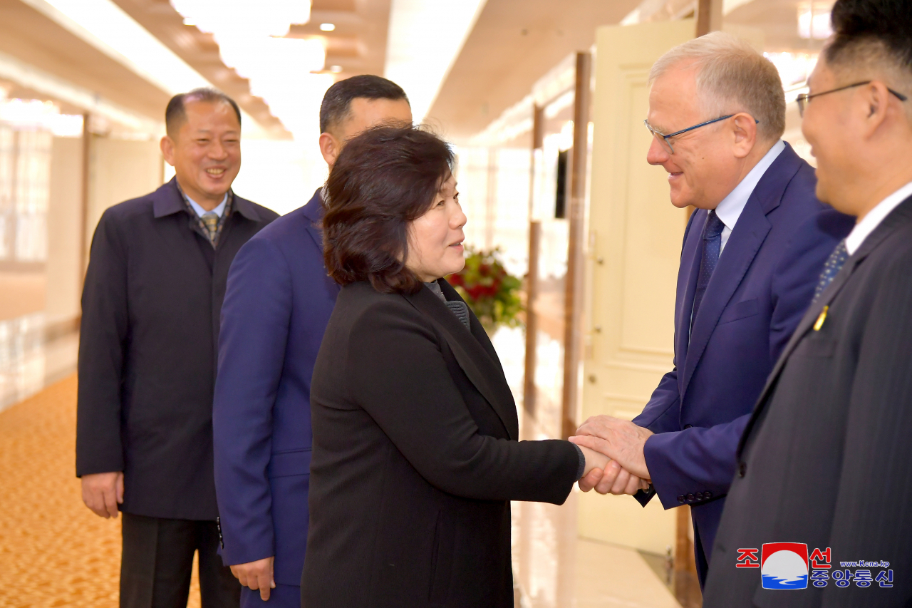 North Korea's Foreign Minister Choe Son-hui shakes hands with Russian Ambassador Aleksandr Matsegora in Pyongyang on Oct. 28, before departing for an official visit to Russia. (Korean Central News Agency-Yonhap)