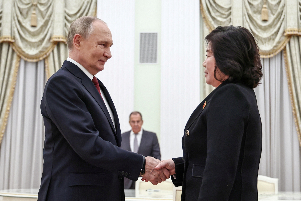 Russian President Vladimir Putin shakes hands with North Korean Foreign Minister Choe Son Hui during a meeting in Moscow, Russia on Monday. (Reuters-Yonhap)