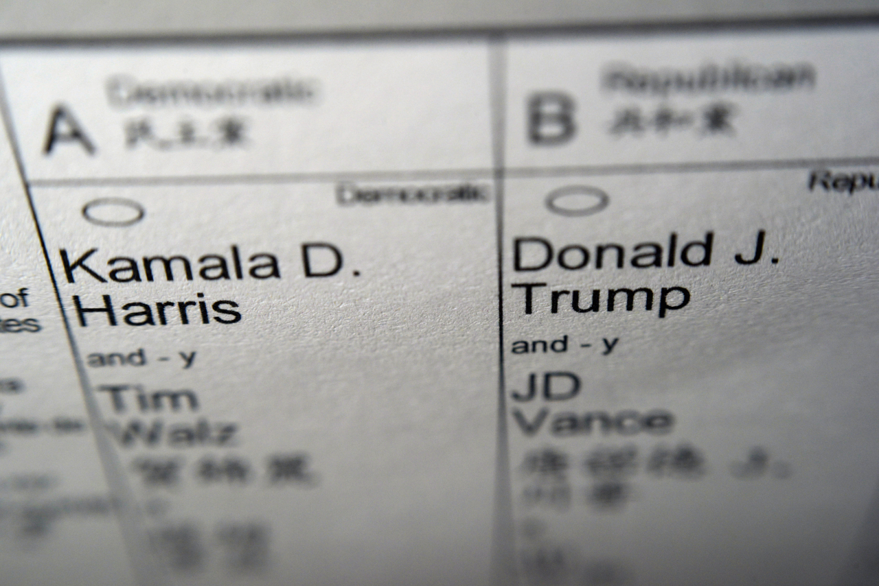 Candidates for president and vice president of the United States, Democrats Vice President Kamala Harris and Minnesota Gov. Tim Walz, and Republicans former President Donald Trump and Sen. JD Vance, R-Ohio, are seen on part of a mail-in election ballot in New York on Sunday. (AP-Yonhap)