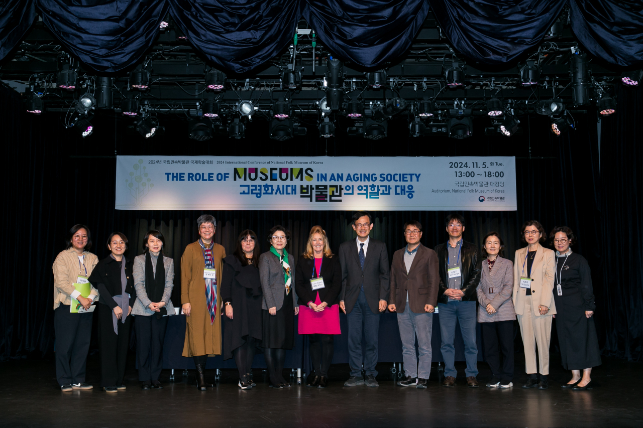 Participants at The Role of Museums in an Aging Society conference pose for photos at the National Folk Museum of Korea in Seoul on Tuesday. (National Folk Museum of Korea)