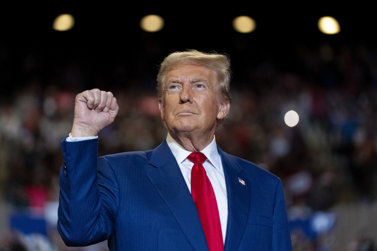 Republican Donald Trump pumps his fist as he arrives to speak at a campaign event at Nassau Coliseum on September 18, 2024, in Uniondale, N.Y. (AP)