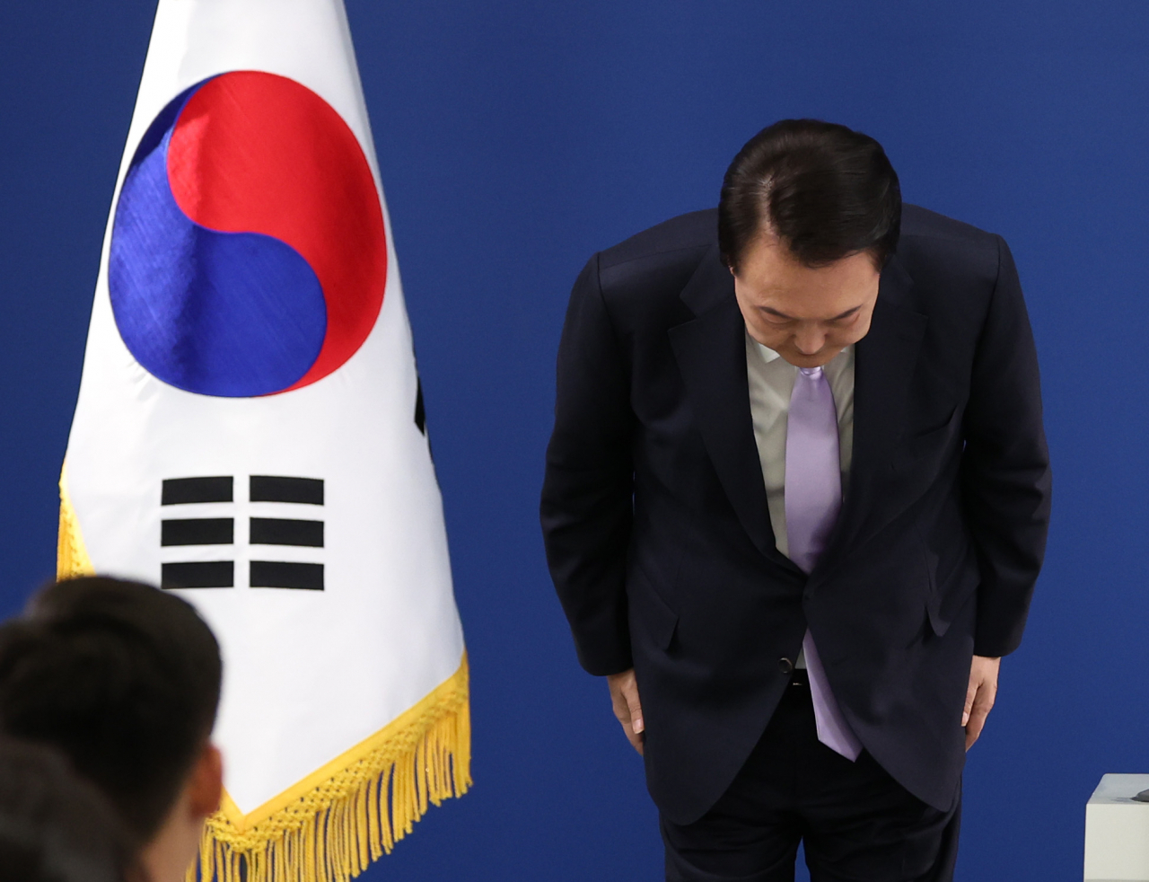 President Yoon Suk Yeol bows in gesture of apologies over controversies involving the first lady before public statement and news conference at the presidential office in Seoul on Thursday. (Yonhap)