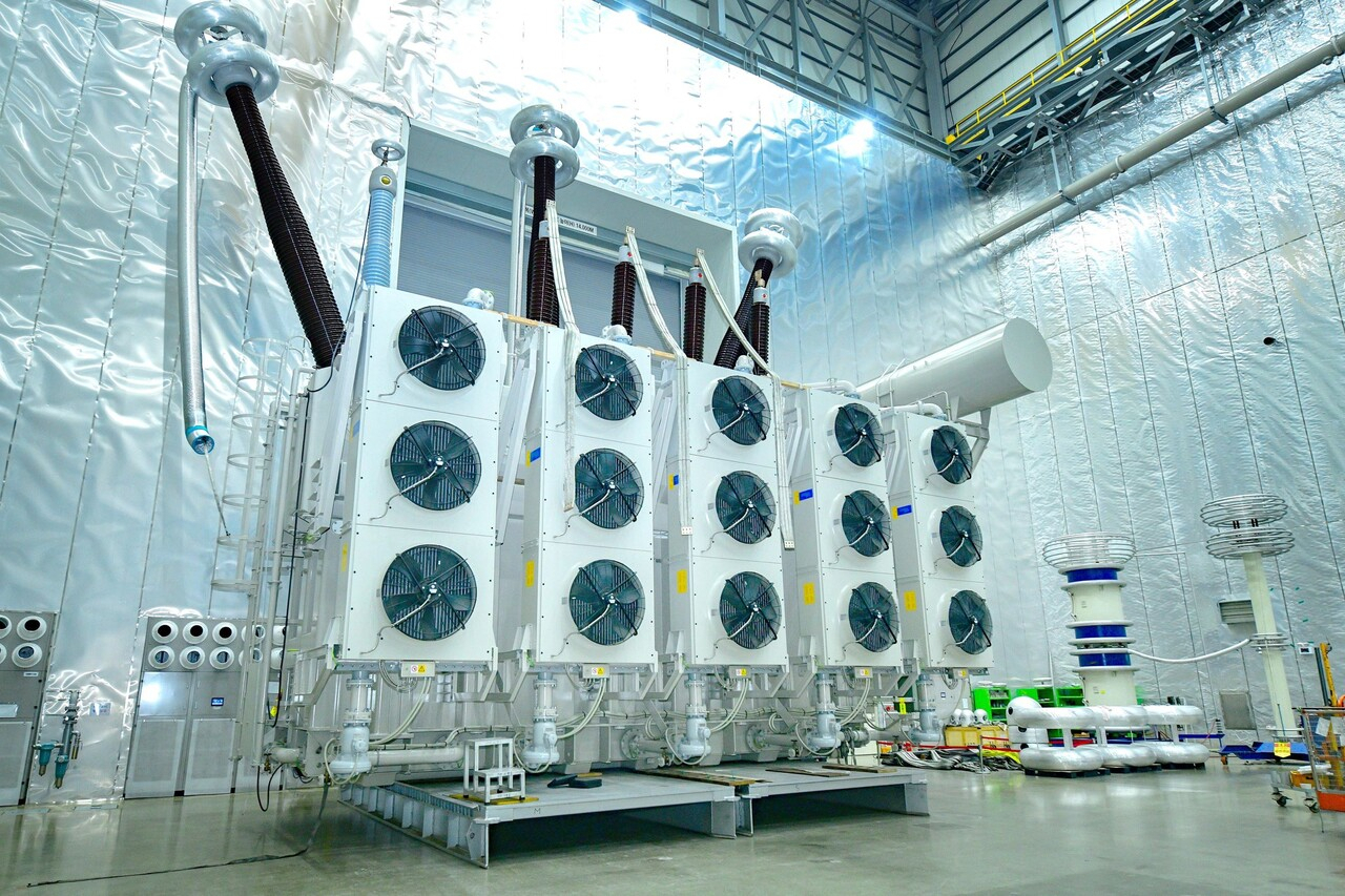 HD Hyundai Electric's ultra-high voltage transformer with advanced cooling systems shown in its Ulsan plant (HD Hyundai Electric)