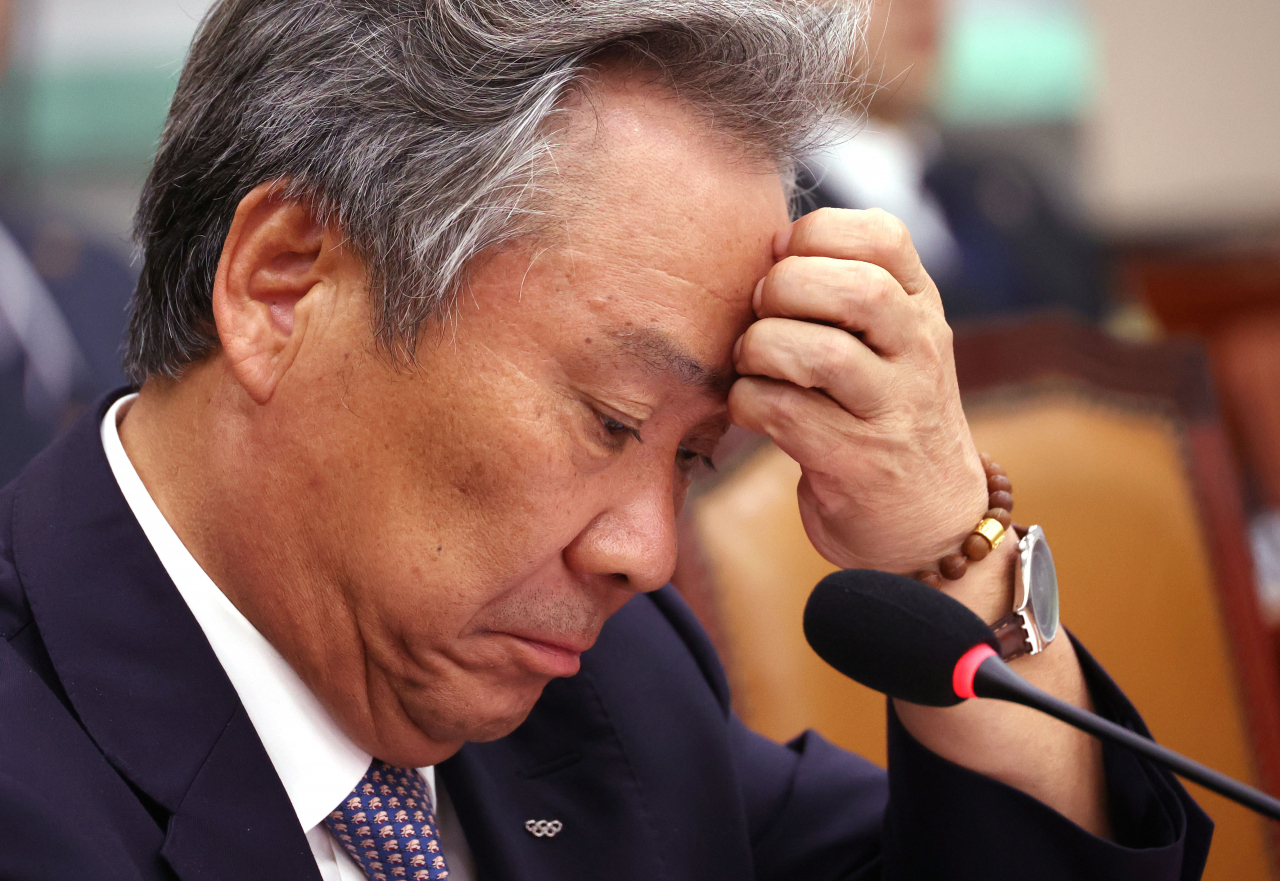 In this file photo from Oct. 22, Lee Kee-heung, president of the Korean Sport & Olympic Committee, listens to a question from a lawmaker during a parliamentary audit at the National Assembly in Seoul. (Yonhap)