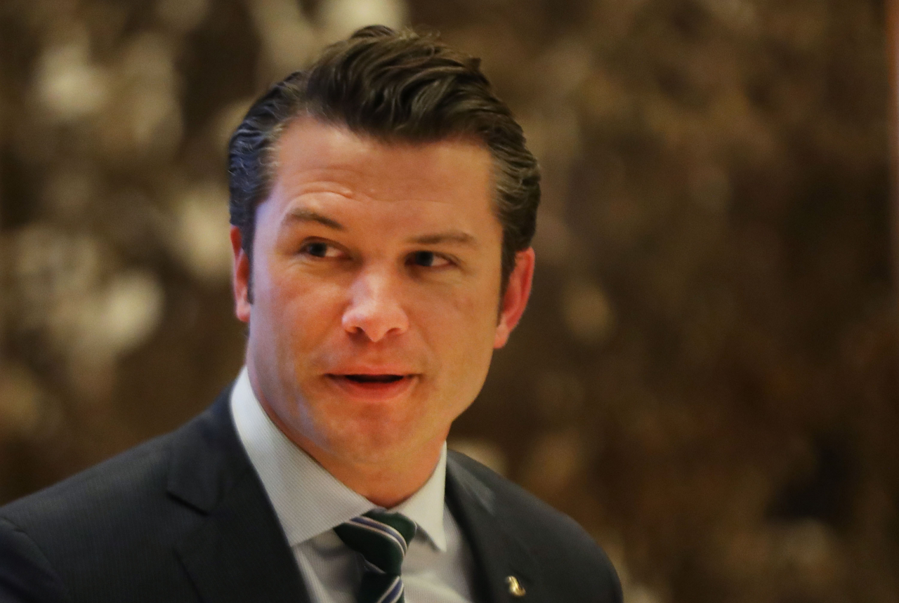 This file photo shows Pete Hegseth walking to an elevator for a meeting with President-elect Donald Trump at Trump Tower in New York on Dec. 15, 2016. (Getty Images)