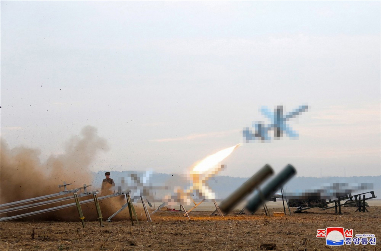 A performance test of suicide attack drones, produced by an affiliated institute of the Unmanned Aerial Technology Complex and other unnamed enterprises, under the supervision of North Korean leader Kim Jong-un on Thursday, in this image provided by the state-run Korean Central News Agency on Friday. Yonhap