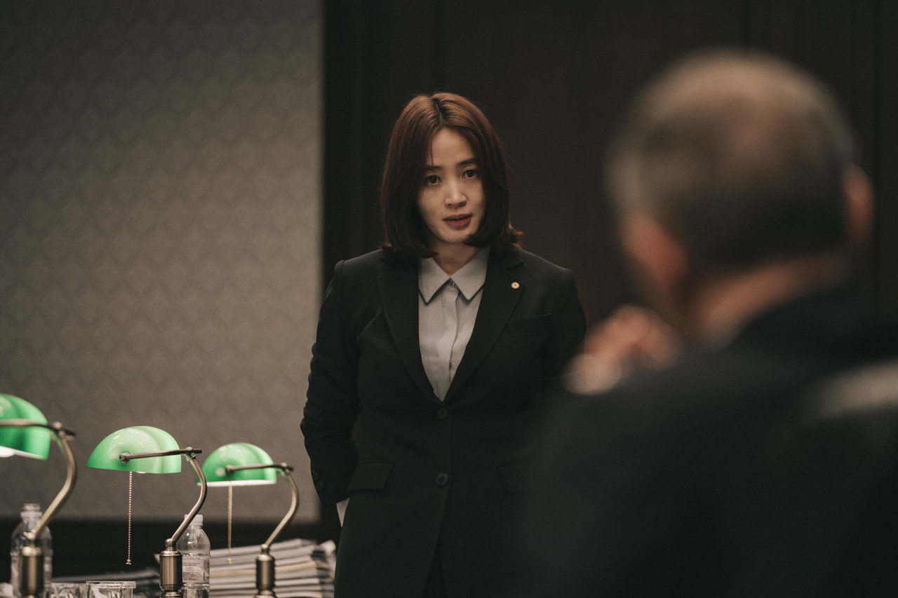 Kim Hye-soo portrays the team leader at the Bank of Korea in the film “Default.” (CJ ENM)