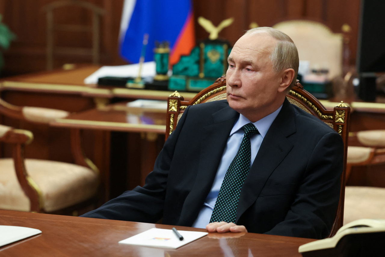 Russian President Vladimir Putin meets with Yevgeny Balitsky, Moscow-installed governor of the Russian-controlled parts of Ukraine's Zaporizhzhia region (not pictured), amid the Russia-Ukraine conflict, at the Kremlin in Moscow, Russia on Monday. (AP-Yonhap)