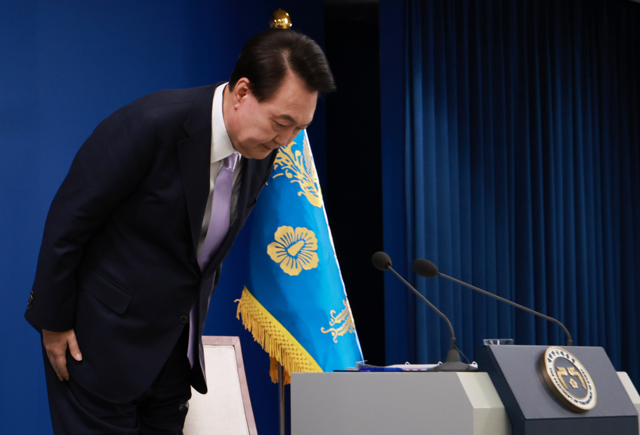 President Yoon Suk Yeol bows in a gesture of apology at a press conference at the presidential office in Seoul, Nov. 7. (Yonhap)