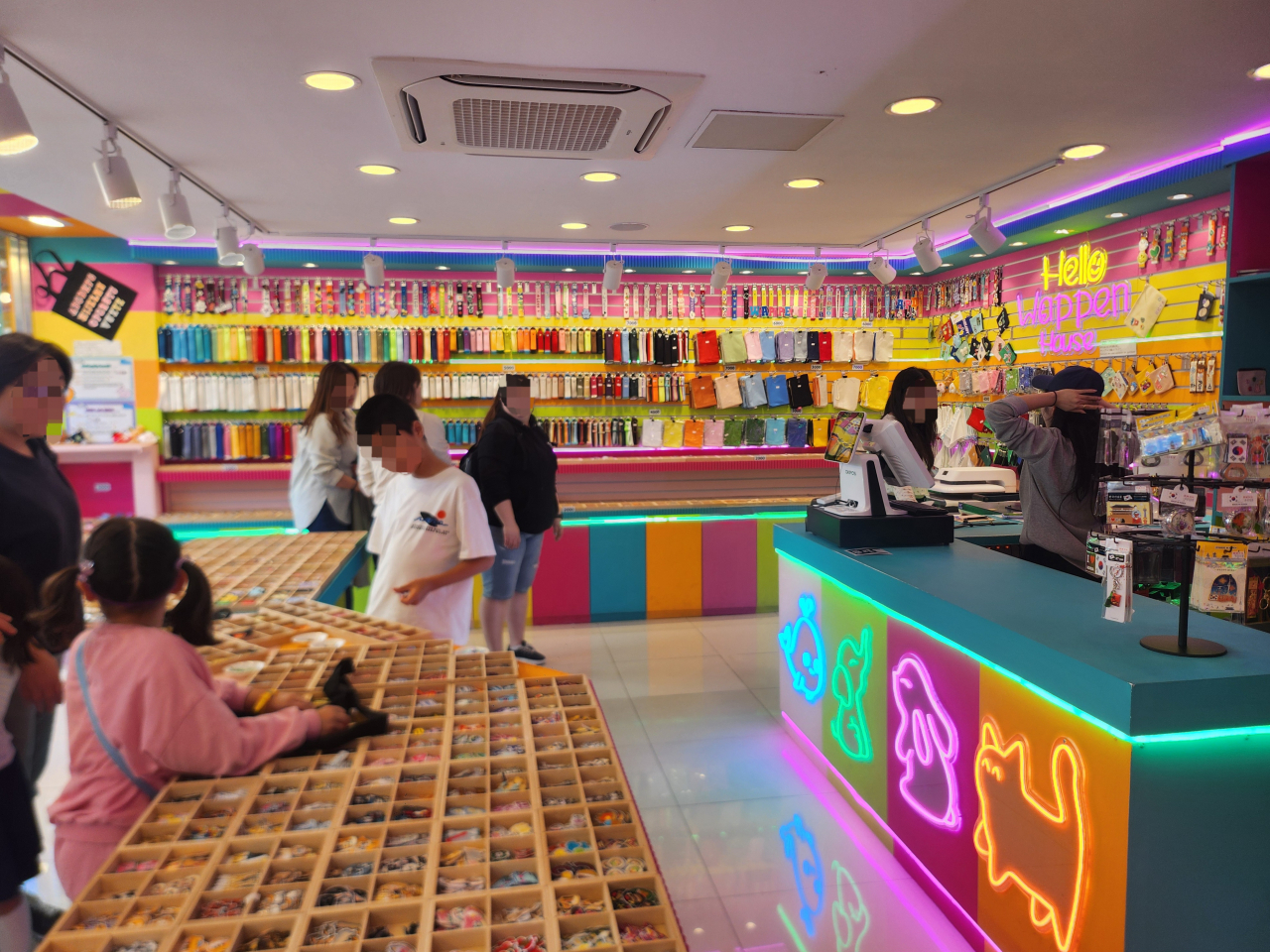 Customers look around patches and merchandise displayed at Wappen House located in Jongno-gu, Seoul. (Lee Jung-youn/The Korea Herald)