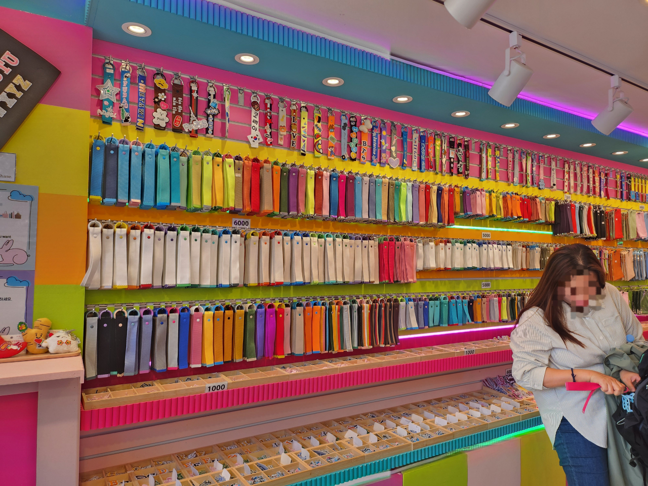 Customers look around patches and merchandise displayed at Wappen House located in Jongno-gu, Seoul. (Lee Jung-youn/The Korea Herald)