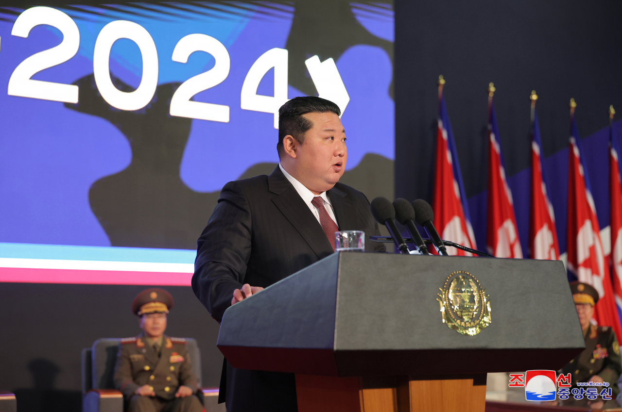 Leader Kim Jong-un delivering a speech at the opening ceremony of an arms exhibition titled 