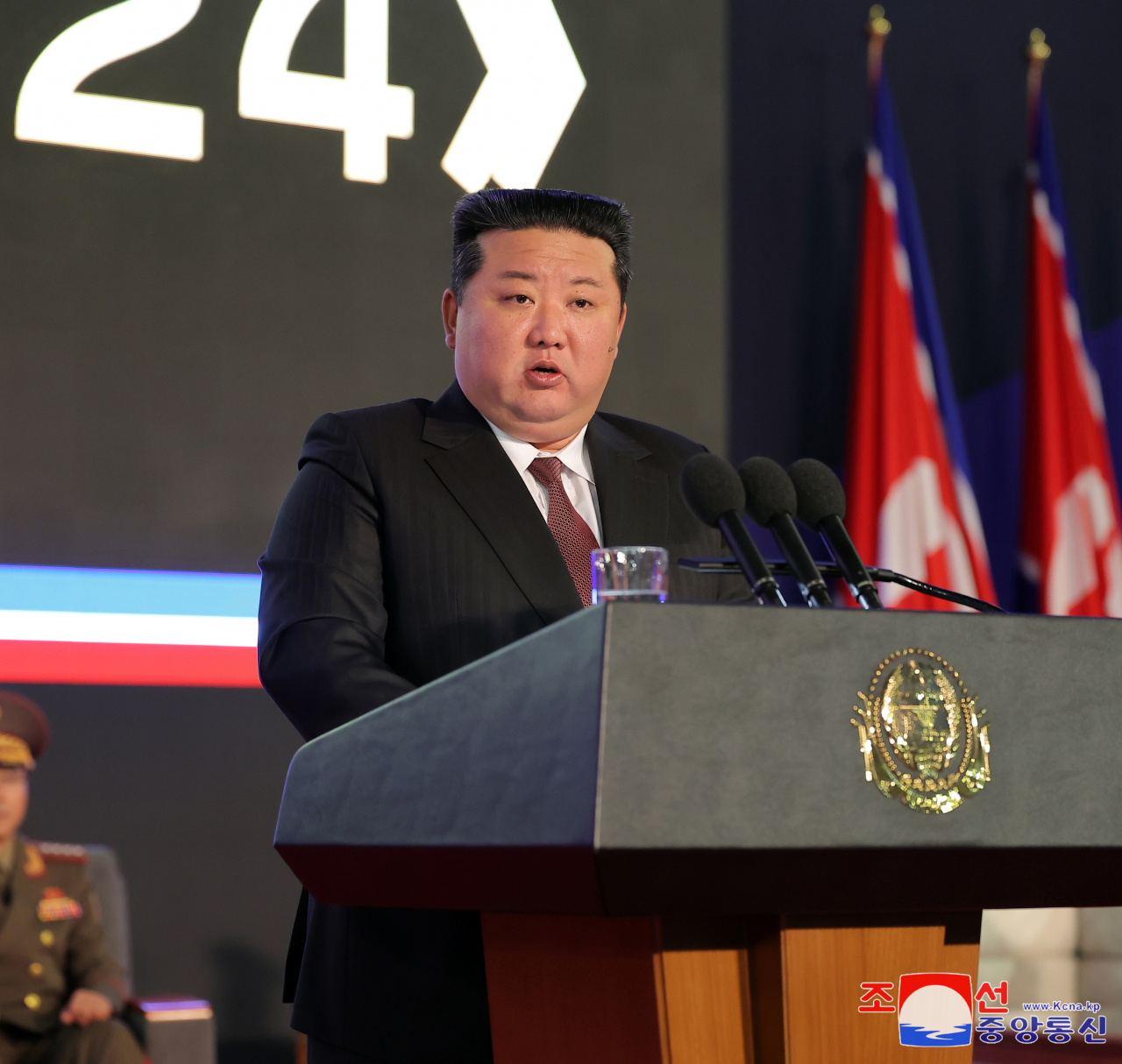 North Korean leader Kim Jong-un speaks during an opening ceremony of a defense exhibition in Pyongyang on Thursday. (Yonhap-Korean Central News Agency)