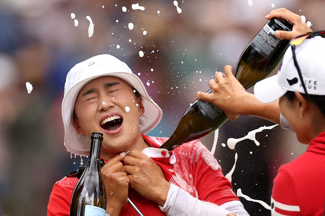 Amy Yang of South Korea is doused with champagne after winning the KPMG Women's PGA Championship at Sahalee Country Club in Sammamish, Washington on June 23. (Getty Images)