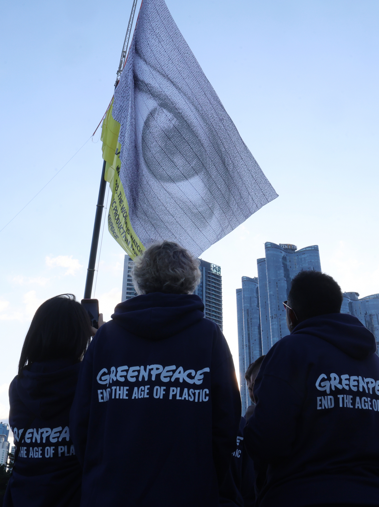 Greenpeace activists watch as the 