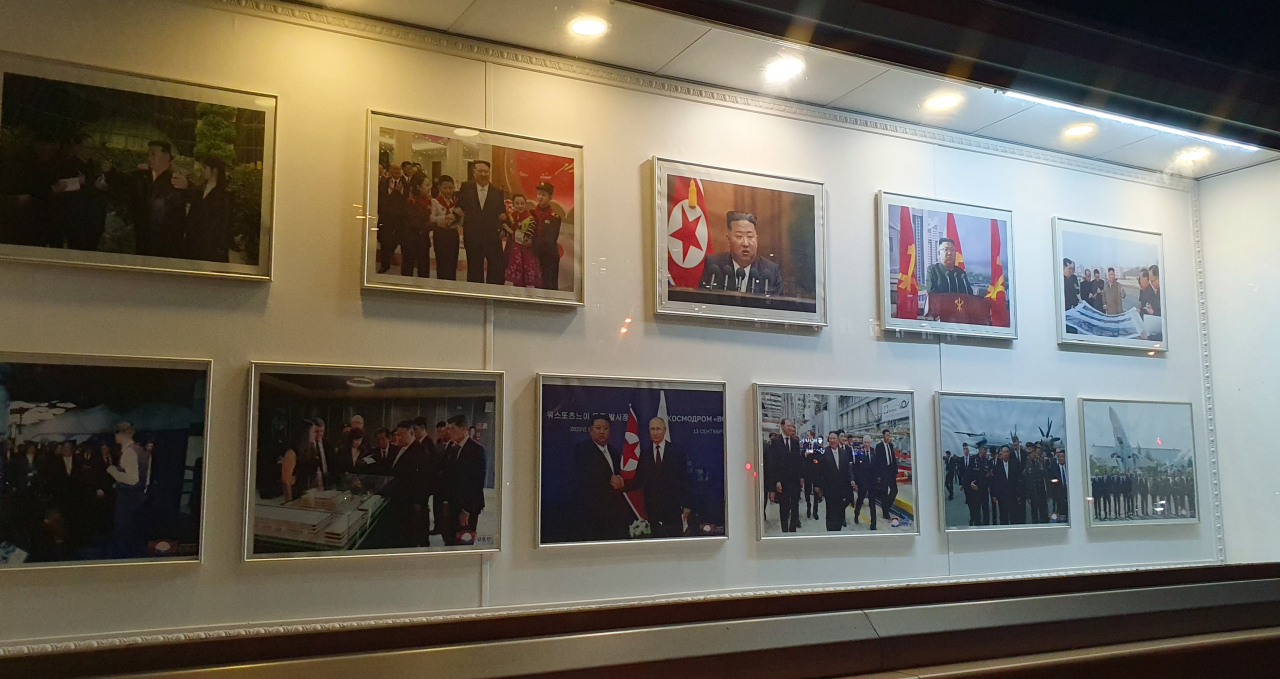 Photographs of the summit between North Korean leader Kim Jong-un and Russian President Vladimir Putin are displayed at the North Korean Embassy in Moscow on Oct. 28. (Yonhap)