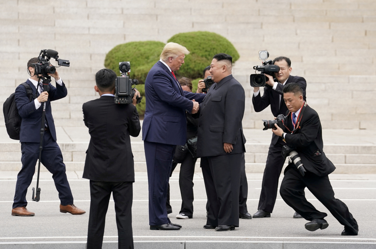 US President Donald Trump meets with North Korean leader Kim Jong-un at the demilitarized zone separating the two Koreas, in Panmunjom, June 30, 2019. (Reuters-Yonhap)