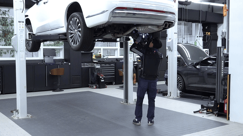 This photo, provided by Hyundai Motor Group on Wednesday shows the company official assembling automotive parts while wearing the X-ble Shoulder exoskeleton at Hyundai Motor Goyang High-tech Center in Gyeonggi Province. (Hyundai Motor Group)