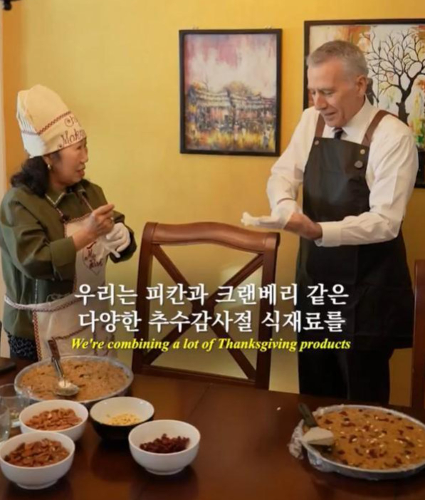 Philip Goldberg, right, US Ambassador to Korea, joins Park Mak-rye, a Korean YouTuber, to make a special traditions-blending dessert in Thanksgiving celebration, Thursday. (US Embassy in Seoul's account on X)