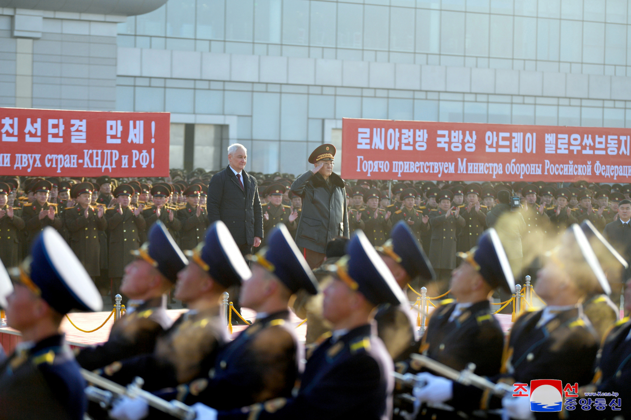 Russian Defence Minister Andrei Belousov (left) is seen by the guard of honour upon his arrival at an airport in Pyongyang on Nov. 29. (Yonhap)