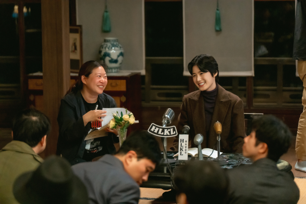 Director Jung Ji-in (left) is seen on the film set of 